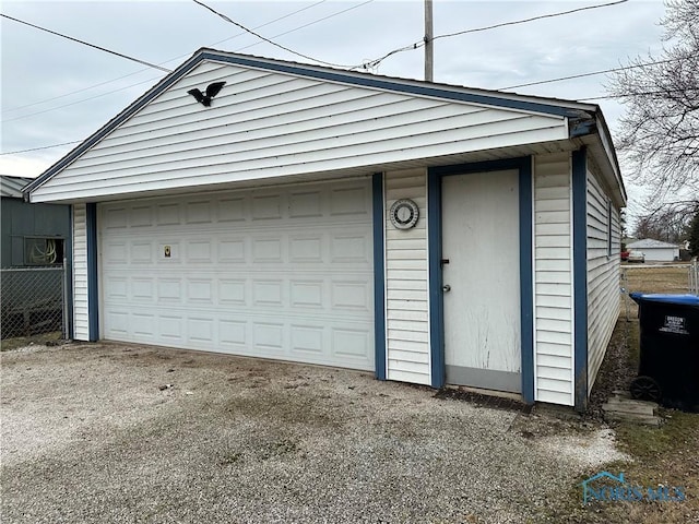 garage featuring fence