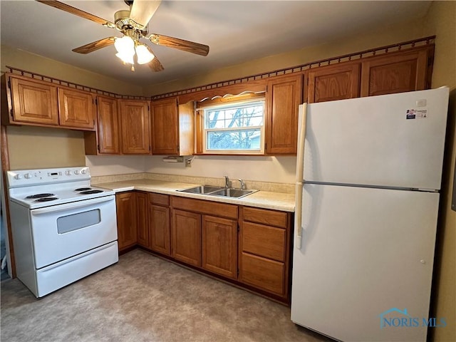 kitchen featuring a sink, white appliances, brown cabinets, and light countertops