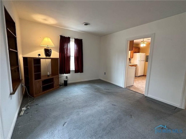 interior space with visible vents, baseboards, and carpet