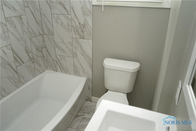 full bath featuring marble finish floor and toilet