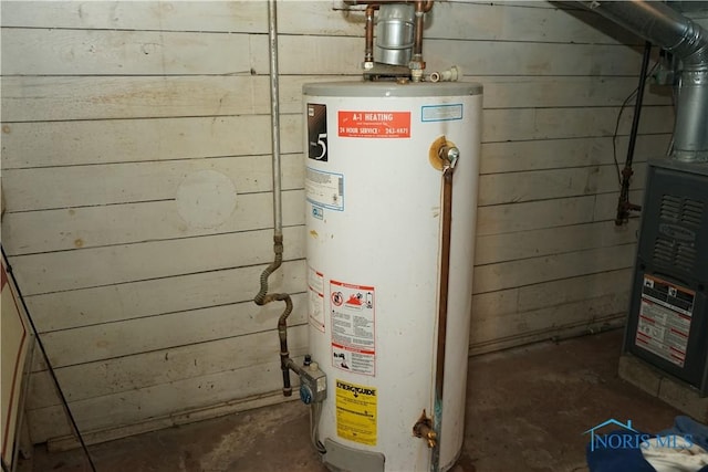 utility room with water heater