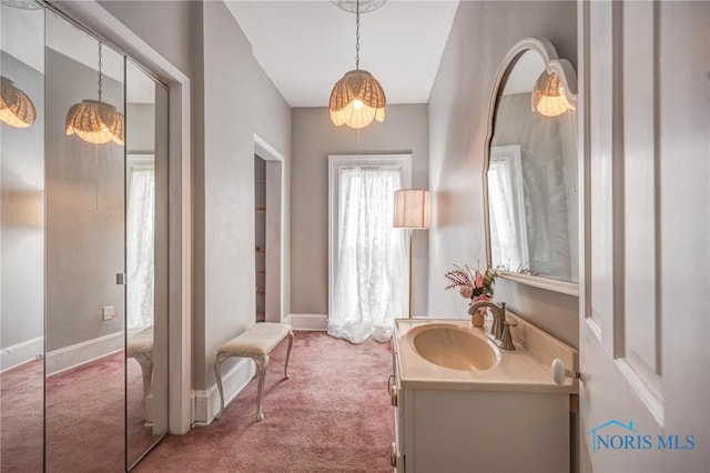 bathroom with vanity and baseboards