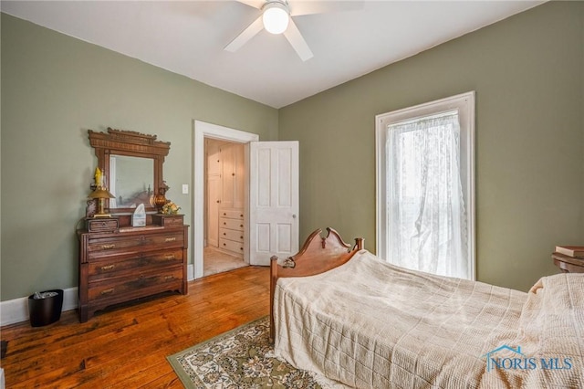 bedroom featuring a ceiling fan and wood finished floors