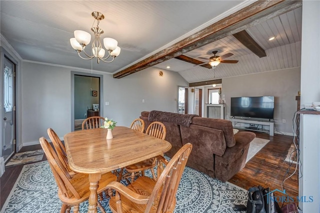 dining area featuring ornamental molding, ceiling fan with notable chandelier, dark wood-style floors, baseboards, and vaulted ceiling with beams