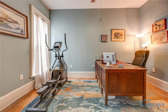 home office featuring light wood-style floors and baseboards