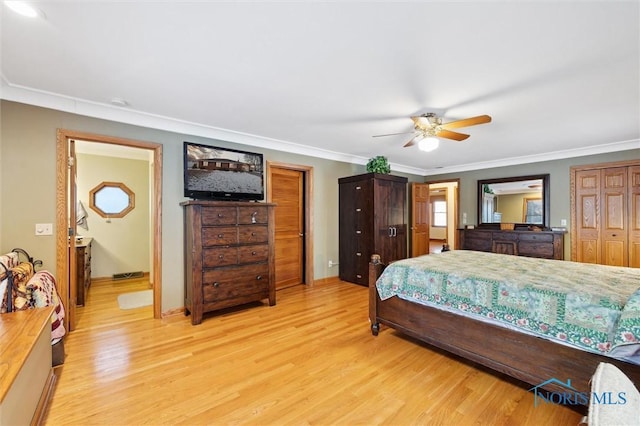 bedroom featuring ceiling fan, ornamental molding, light wood-style flooring, and baseboards