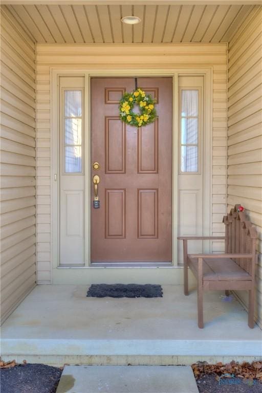 doorway to property featuring covered porch