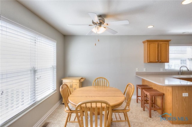 dining room featuring recessed lighting, a ceiling fan, and baseboards