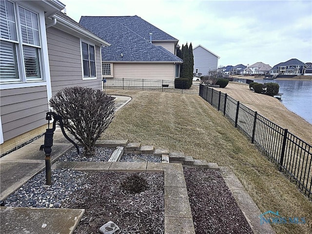 view of yard with a fenced backyard and a residential view