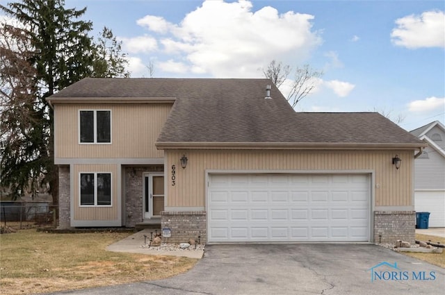 view of front facade with driveway, brick siding, roof with shingles, and an attached garage