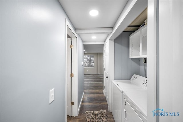 laundry room featuring laundry area, dark wood-type flooring, and washer and clothes dryer