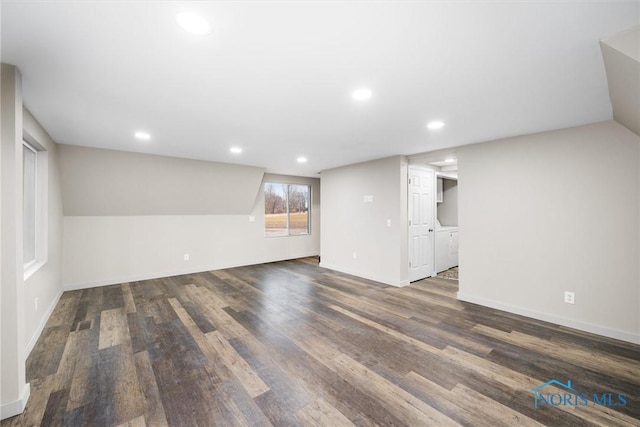 basement with baseboards, wood finished floors, and recessed lighting