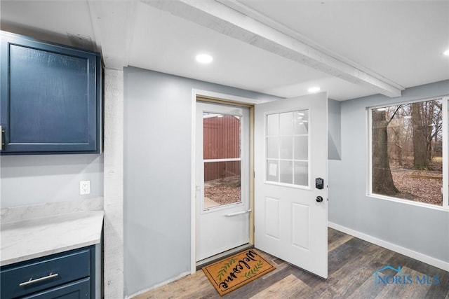 doorway with baseboards, dark wood-style flooring, beam ceiling, a wealth of natural light, and recessed lighting