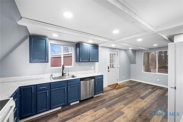 kitchen with stainless steel dishwasher, a sink, freestanding refrigerator, and blue cabinets