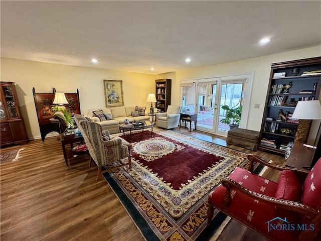 living room featuring recessed lighting, french doors, and wood finished floors