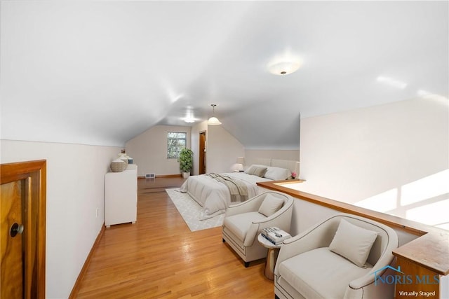 8134 W Central Ave, Toledo, OH 43617 - bedroom with lofted ceiling, light wood-style floors, visible vents, and baseboards