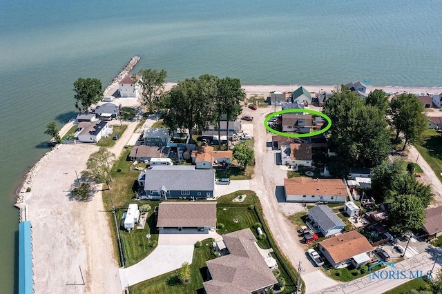 aerial view featuring a water view and a residential view