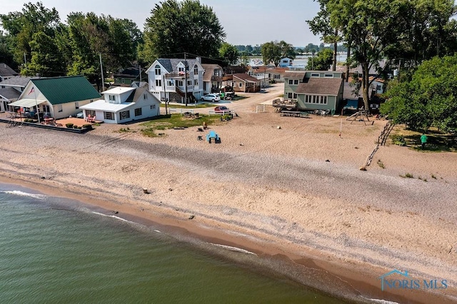 bird's eye view with a residential view, a view of the beach, and a water view