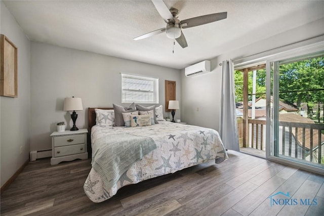 bedroom featuring a ceiling fan, wood finished floors, a wall mounted air conditioner, access to exterior, and baseboard heating