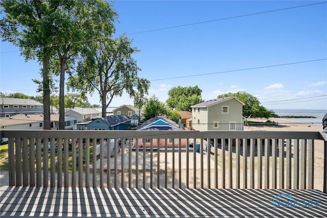 wooden terrace featuring a residential view