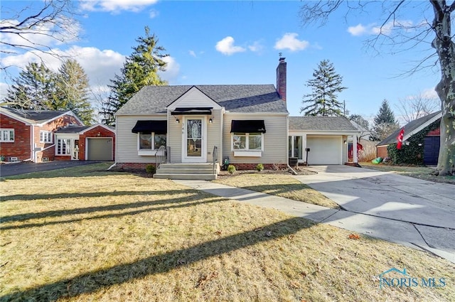 view of front of property featuring roof with shingles, a chimney, concrete driveway, a front lawn, and a garage