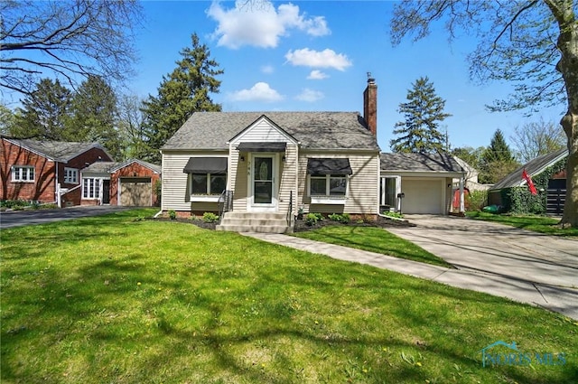 view of front facade featuring a front lawn, driveway, and a chimney