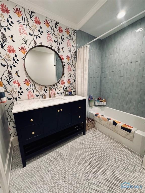 full bath with ornamental molding, shower / bath combo with shower curtain, and vanity