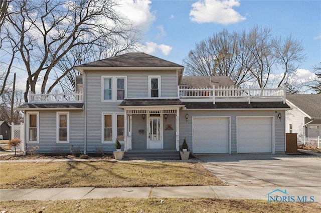 view of front of house featuring concrete driveway, a balcony, an attached garage, and a shingled roof