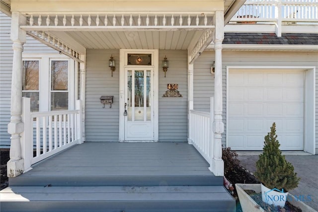 view of exterior entry with covered porch