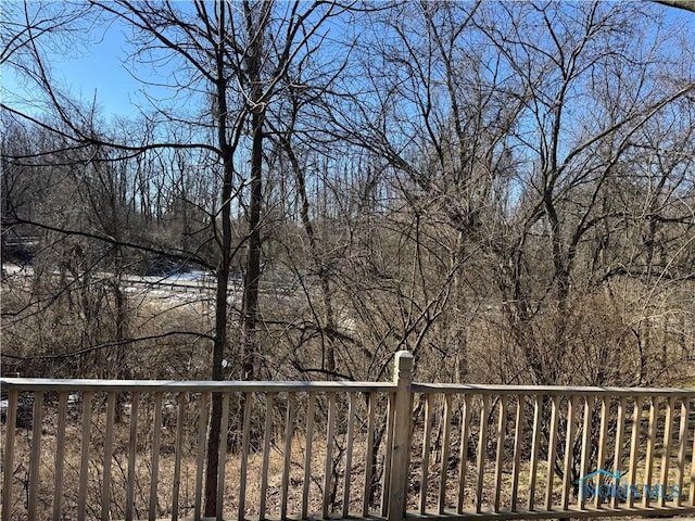 deck featuring a forest view