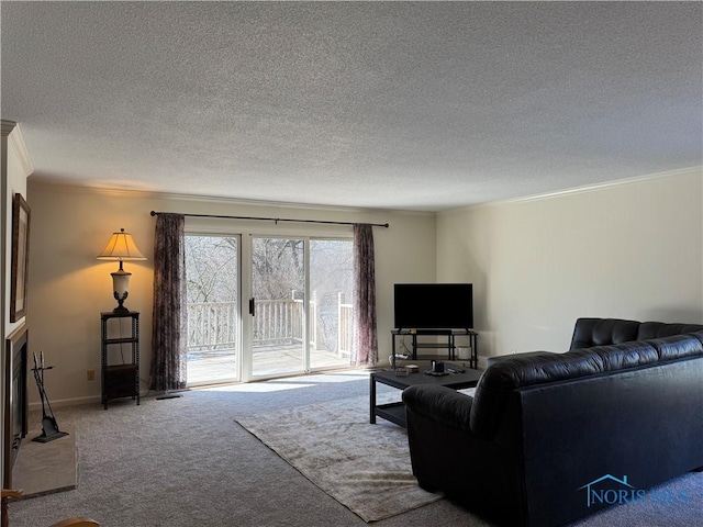 carpeted living room with crown molding, a textured ceiling, and baseboards