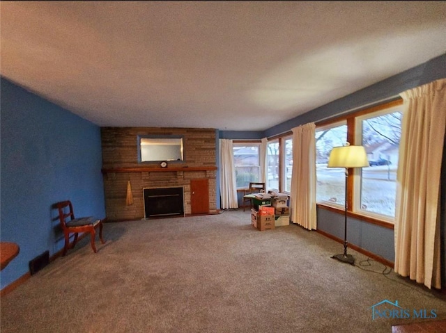 1934 Geffs Ave, Findlay, OH 45840 - interior space with visible vents, baseboards, carpet flooring, a fireplace, and a textured ceiling