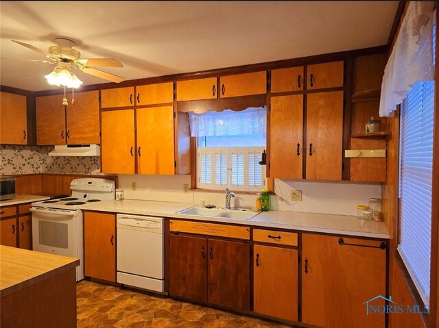 1934 Geffs Ave, Findlay, OH 45840 - kitchen featuring white appliances, light countertops, under cabinet range hood, and a sink
