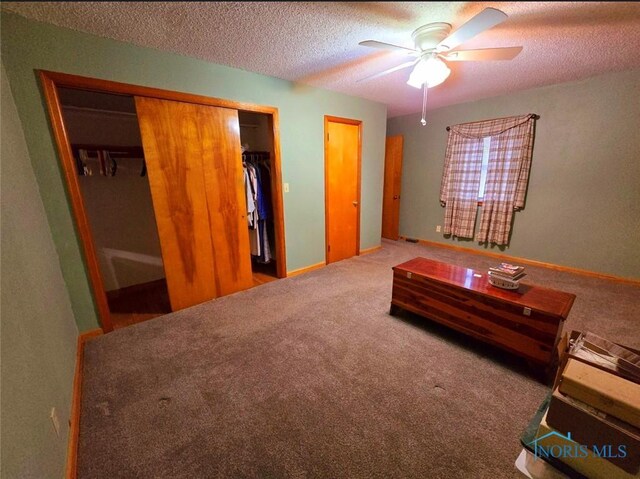 1934 Geffs Ave, Findlay, OH 45840 - bedroom featuring a closet, a textured ceiling, a ceiling fan, and carpet floors