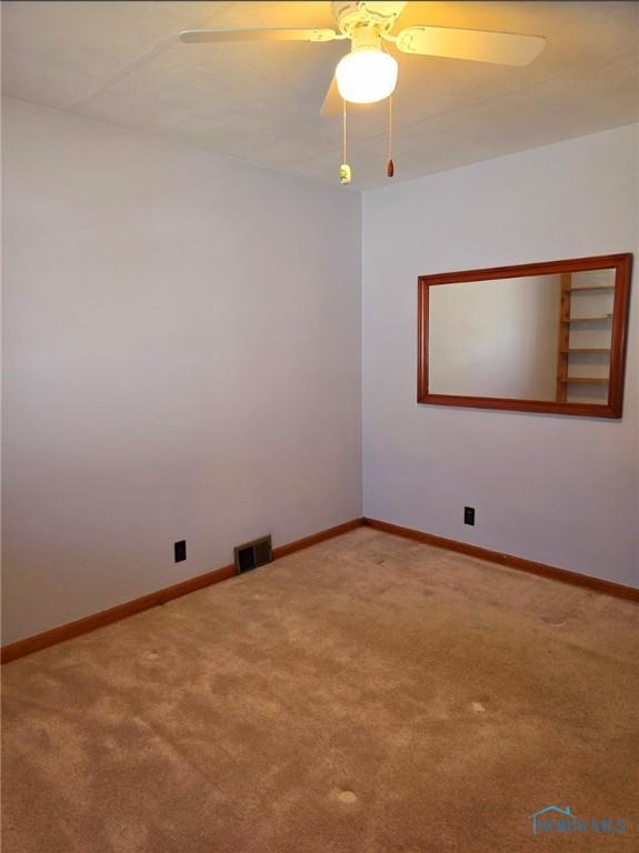1934 Geffs Ave, Findlay, OH 45840 - carpeted spare room featuring a ceiling fan, baseboards, and visible vents