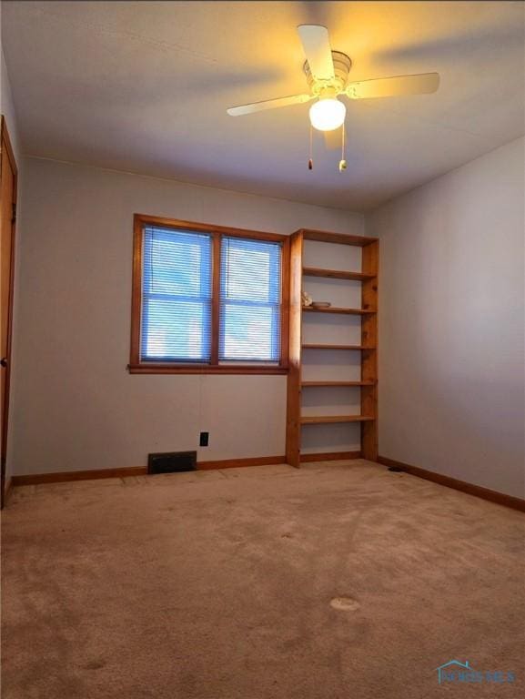 1934 Geffs Ave, Findlay, OH 45840 - unfurnished bedroom featuring baseboards, light carpet, visible vents, and a ceiling fan