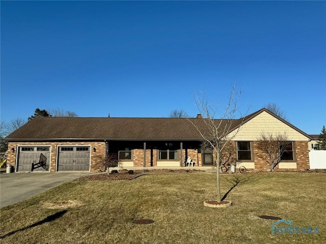 ranch-style house with brick siding, asphalt driveway, a garage, a front yard, and a chimney