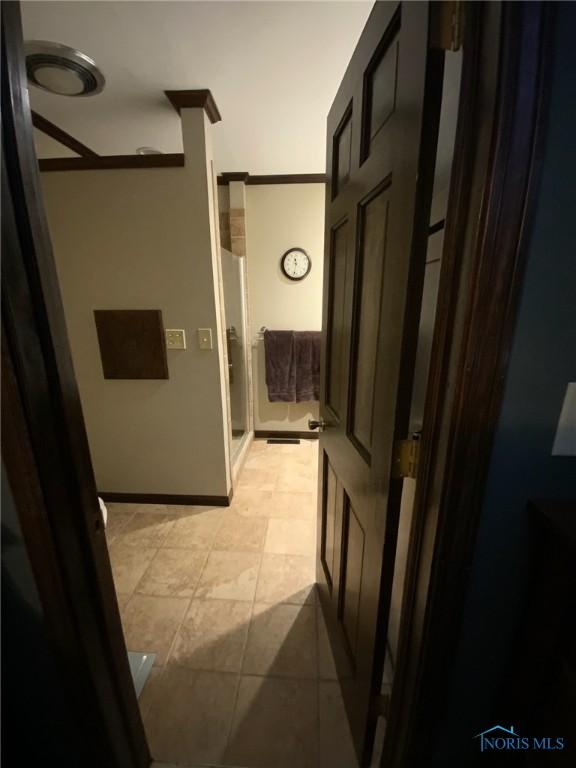 corridor with light tile patterned flooring