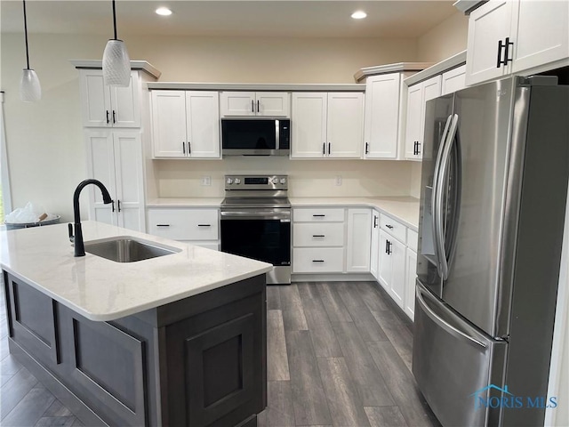 9641 Early Dr, Findlay, OH 45840 - kitchen featuring recessed lighting, a sink, hanging light fixtures, dark wood-type flooring, and stainless steel appliances