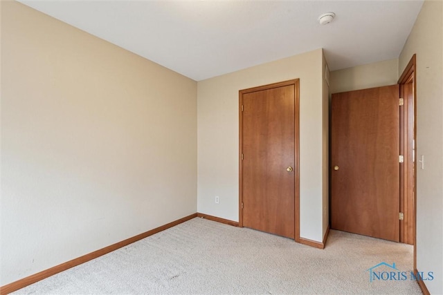 14540 Olde Trail Dr, Perrysburg, OH 43551 - unfurnished bedroom with a closet, light colored carpet, and baseboards