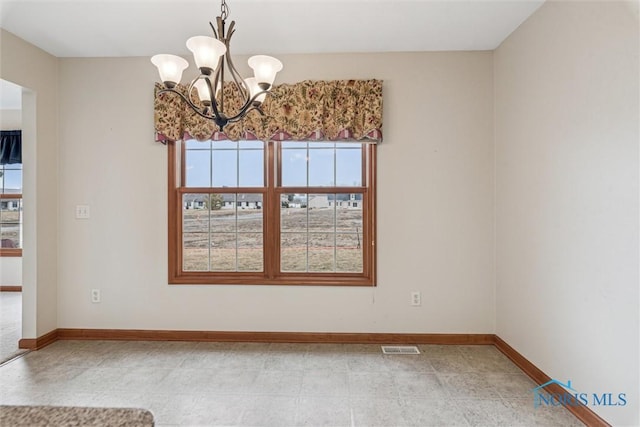 14540 Olde Trail Dr, Perrysburg, OH 43551 - spare room with a notable chandelier, visible vents, and baseboards