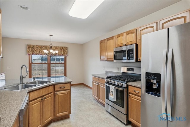 14540 Olde Trail Dr, Perrysburg, OH 43551 - kitchen featuring a sink, decorative light fixtures, appliances with stainless steel finishes, an inviting chandelier, and baseboards