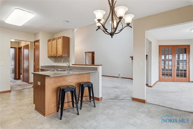 14540 Olde Trail Dr, Perrysburg, OH 43551 - kitchen featuring a sink, baseboards, and light colored carpet