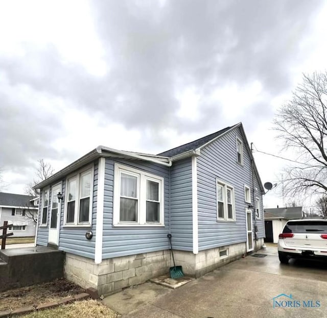 view of property exterior featuring driveway