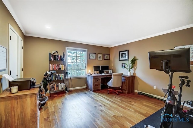 home office featuring crown molding, baseboards, and wood finished floors