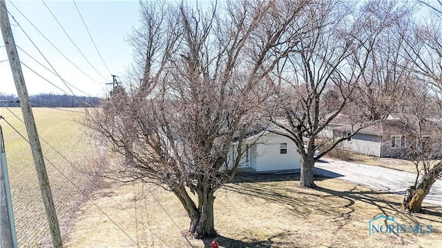 exterior space with dirt driveway