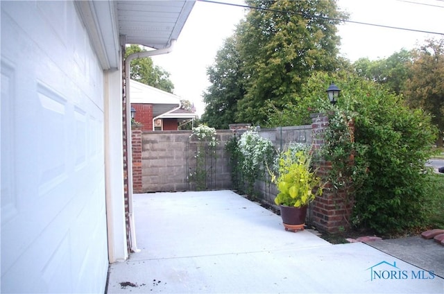 view of patio / terrace featuring fence