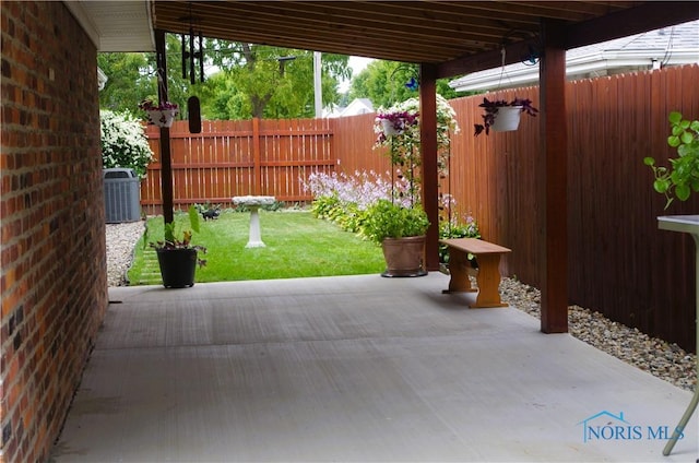 view of patio / terrace featuring central air condition unit and fence