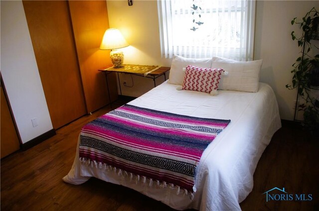 bedroom featuring wood finished floors