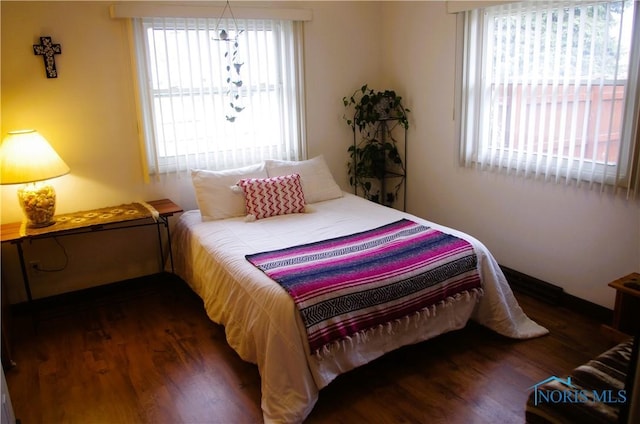 bedroom featuring wood finished floors